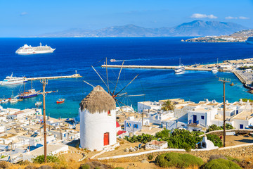 A view of a famous windmill in Mykonos port, Cyclades islands, Greece - obrazy, fototapety, plakaty