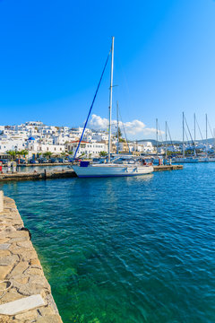 NAOUSSA PORT, PAROS ISLAND - MAY 17, 2016: Sailing boat mooring in Naoussa port on Paros island, Cyclades, Greece.