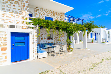 Beautiful Greek houses on street of Naoussa village, Paros island, Cyclades, Greece