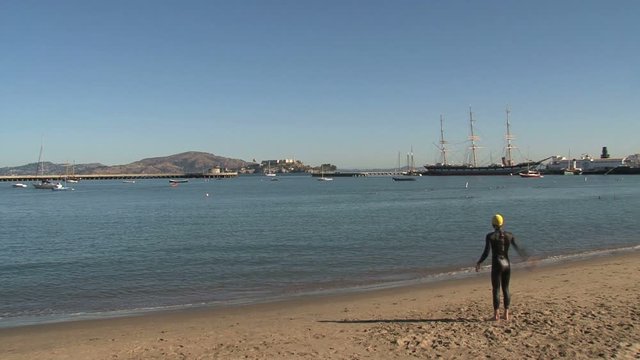 Swimmer warming up before swimming in the San Francisco bay