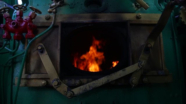 Steam train's furnace opens and closes.
