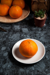 Fresh orange fruits and juice on marble table. Flat lay.