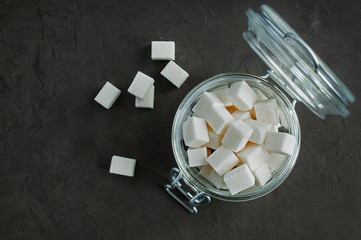 White cubes sugar in a glass jar