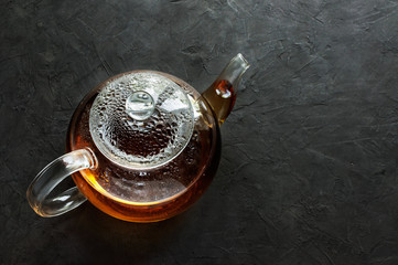 Glass teapot with hot tea