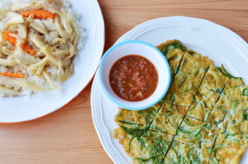 egg with climbing wattle dipping shrimp chili paste sauce and stir fried mushroom on rice