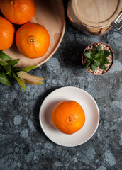 Fresh orange fruits and juice on marble table. Flat lay.