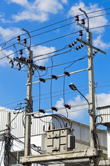 High voltage electrical transformer and cable on concrete pole