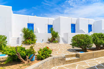 Typical street with Greek style white houses in Santa Maria village, Paros island, Greece © pkazmierczak