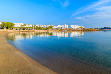 Fototapeta premium A view of beach in Naoussa village at sunrise time, Paros island, Cyclades, Greece