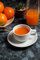 Fresh orange fruits and juice on marble table. Flat lay.