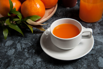 Fresh orange fruits and juice on marble table. Flat lay.