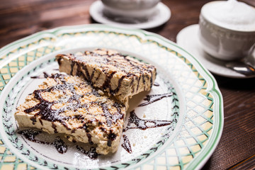 coffee americano with beans on wooden table