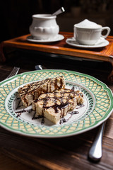 coffee americano with beans on wooden table