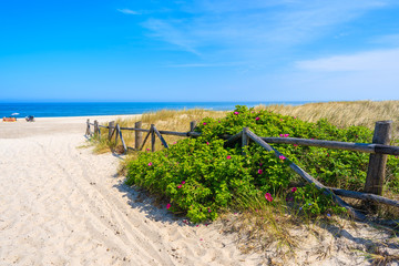 Entrance to beautiful sandy beach in Lubiatowo coastal village, Baltic Sea, Poland