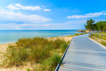 Coastal promenade along beach in Pucka bay on Hel peninsula, Baltic Sea, Poland - obrazy, fototapety, plakaty