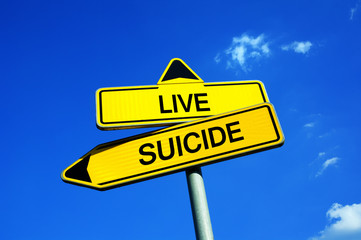 Fototapeta premium Live or Suicide - Traffic sign with two options - appeal to overcome problems, crisis, hopelessness and depression. Overcoming negativity with positive attitude
