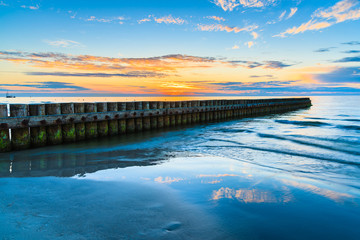Sunset over sea on a beach in Leba, Baltic Sea, Poland