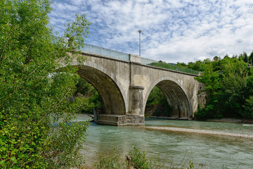 Fototapeta na wymiar Stone bridge over the river Drome in France.