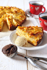 Apple pie, ice cream and two cups of coffee