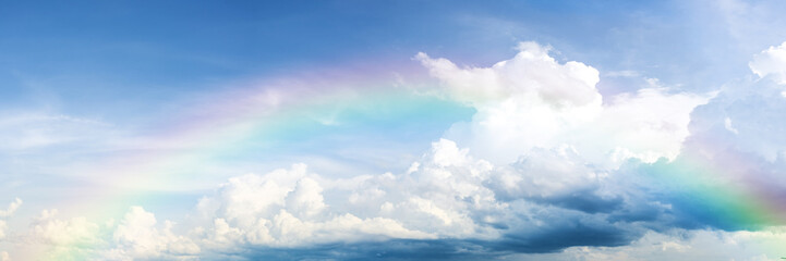 beautiful classic rainbow across in the blue sky after the rain.