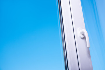 view to blue sky from modern plastic window