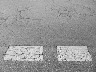 closeup on concrete asphalt cracks on the road
