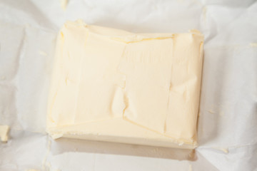 Closeup of open bricket of butter with selective focus