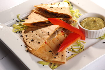 Mexican Tortilla with meat sauce and guacamole