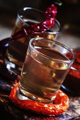 Traditional Ukrainian vodka with pepper gorilka, dark vintage wo