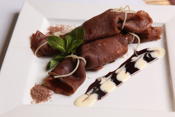 chocolate pancake with cream and fruit