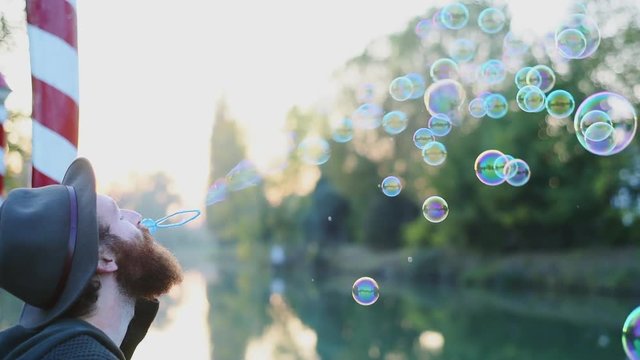 Blowing bubbles at sunset