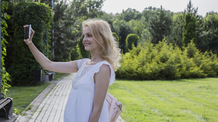 The smartphone in the hands of a young woman