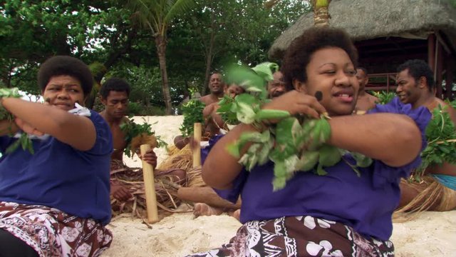 Fijian men and women taking part in ceremonial song