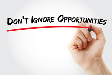 Hand writing Don't Ignore Opportunities with marker, concept background