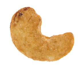 Whole honey roasted cashew on a white background top view.