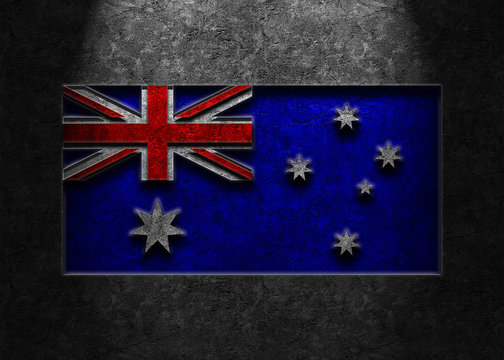 Flag of Australia rendered in a smooth, dark, weathered stone texture with lighting from top center