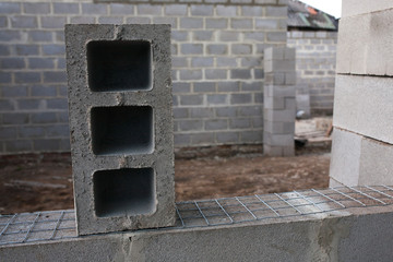 Stack of cement blocks at the construction site. cinder blocks background.