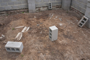 Stack of cement blocks at the construction site. cinder blocks background.