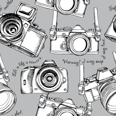 Seamless pattern with the images of cameras. Vector illustration.
