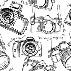 Naklejki  Seamless pattern with the images of cameras. Vector illustration.