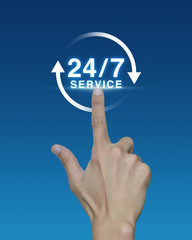 Hand pressing button 24 hours service icon on blue background, F