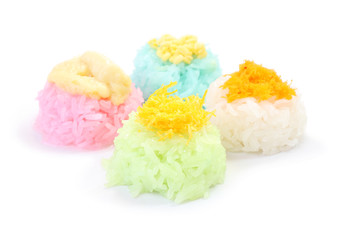 Multiple color of sticky rice with sugar custard on white floor.