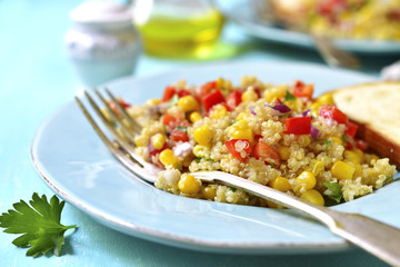 Quinoa salad with bell pepper,tomatoes,red onion,sweet corn and