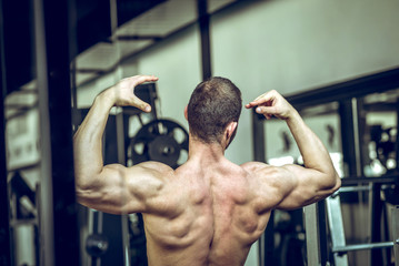 Man showing back in gym