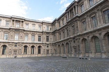 Fototapeta na wymiar Paris, France - April 28, 2016: Louvre building in Paris, France. With 9 million annual visitors, Louvre is consistently the most visited museum worldwide
