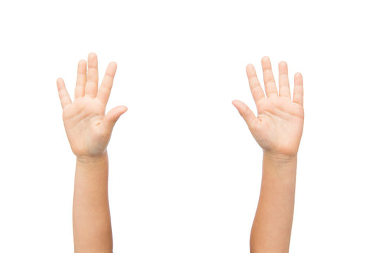 close up of little child hands raised upwards