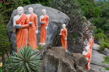 Line of Buddhist statues near Dambulla golden temple