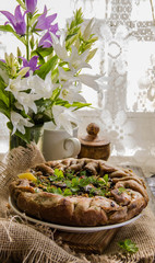 Cut a piece of pie(rye biscuit) with mushrooms, potatoes 