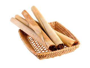 Tobacco and cigarette in the basket on white background