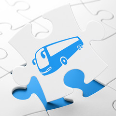 Tourism concept: Bus on puzzle background